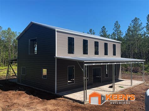 2 story cream house with porch with metal roofing|2 story metal roof exterior ideas.